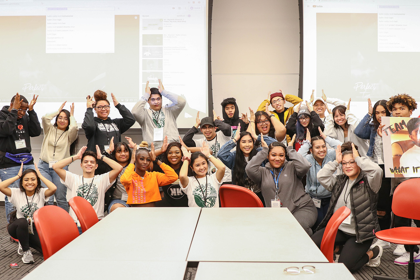 High School students and student leaders making coug ears during the annual shaping conference